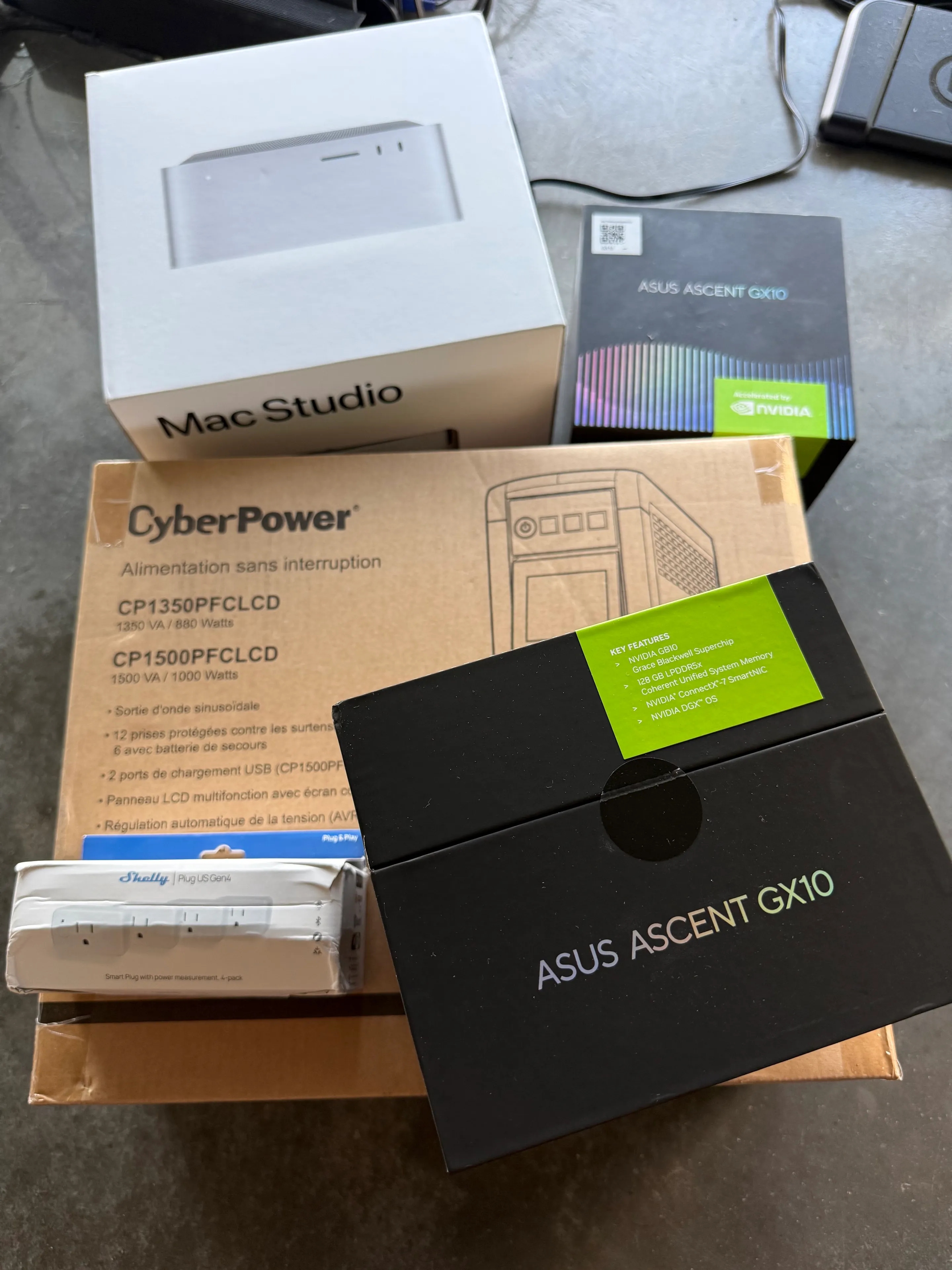 The second ASUS GX10, CyberPower UPS, smart plugs, and Mac Studio ready for the local AI setup